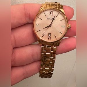 Women’s bulova rose gold and mother of pearl watch